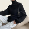 Women’s oversized turtleneck cable-knit sweater by Yeha Maison, featuring chunky knit pattern and relaxed fit in neutral tones.