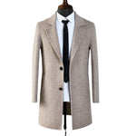 Yeha Maison slim herringbone wool overcoat hanging on a wooden hanger, showcasing its tailored design and classic pattern.