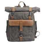 Waxed canvas roll-top backpack by Yeha Maison, durable bag with adjustable straps and multiple compartments.