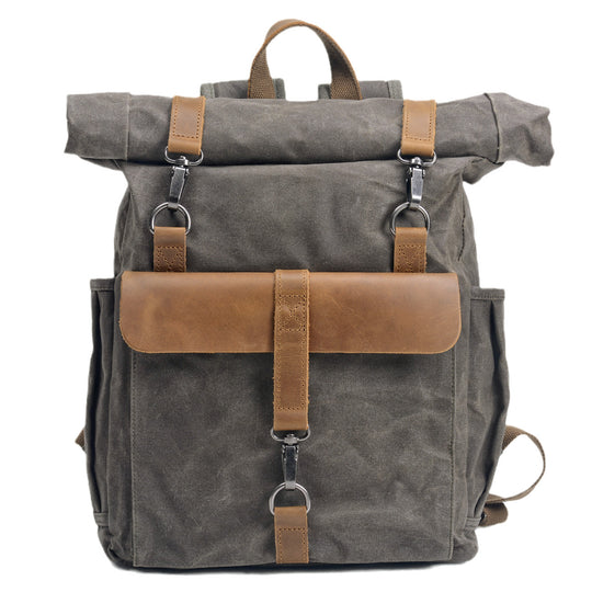 Waxed canvas roll-top backpack by Yeha Maison, durable bag with adjustable straps and multiple compartments.