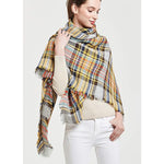 Women's yellow plaid tassel blanket scarf by Yeha Maison, featuring fringed edges and cozy, warm fabric.