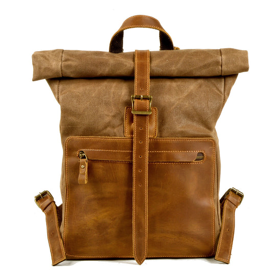 Men's wax canvas and leather roll-top backpack with adjustable straps and multiple compartments, designed by Yeha Maison.